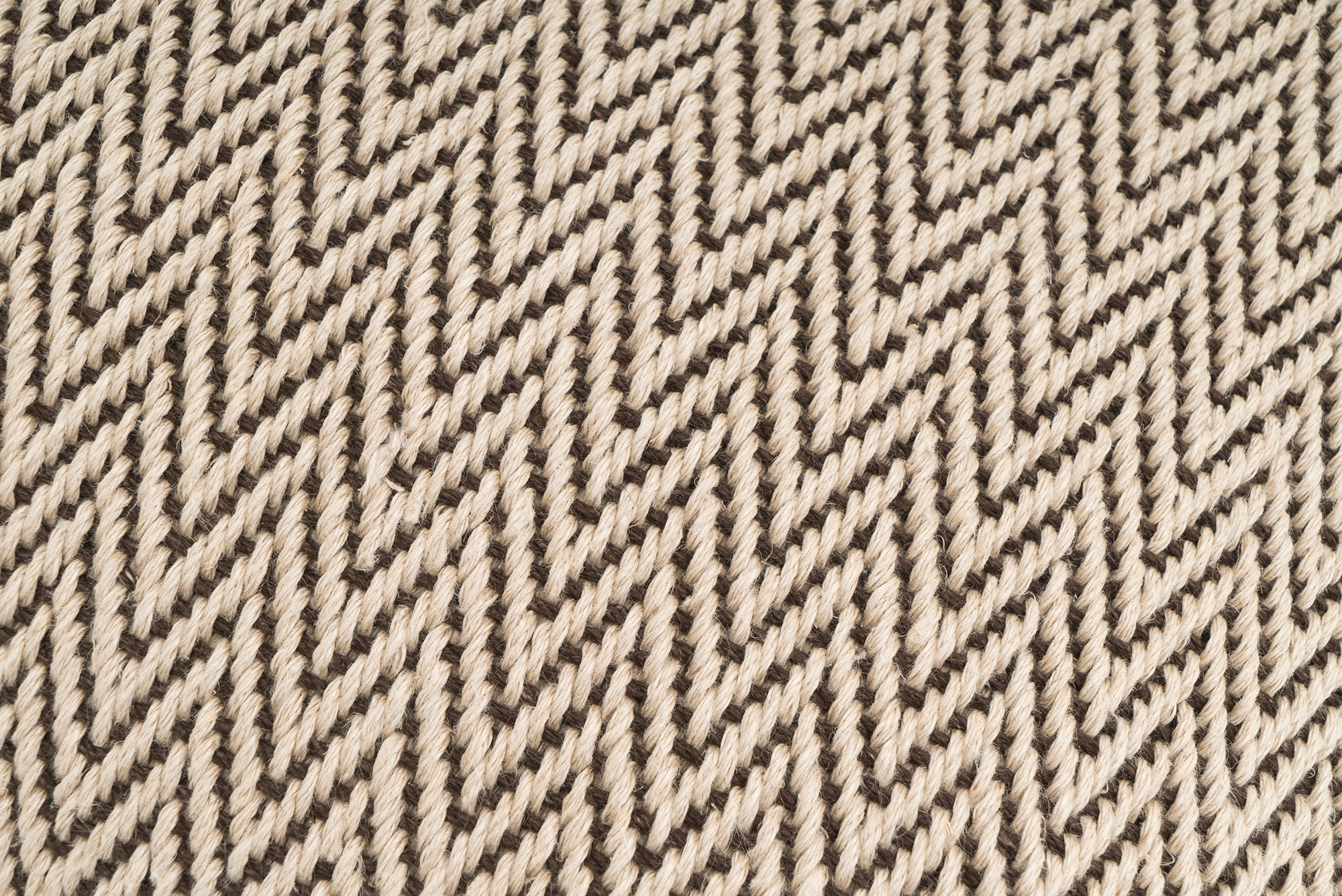 Artisan-crafted hemp pillowcase, featuring zigzag chevron pattern, sustainable material.