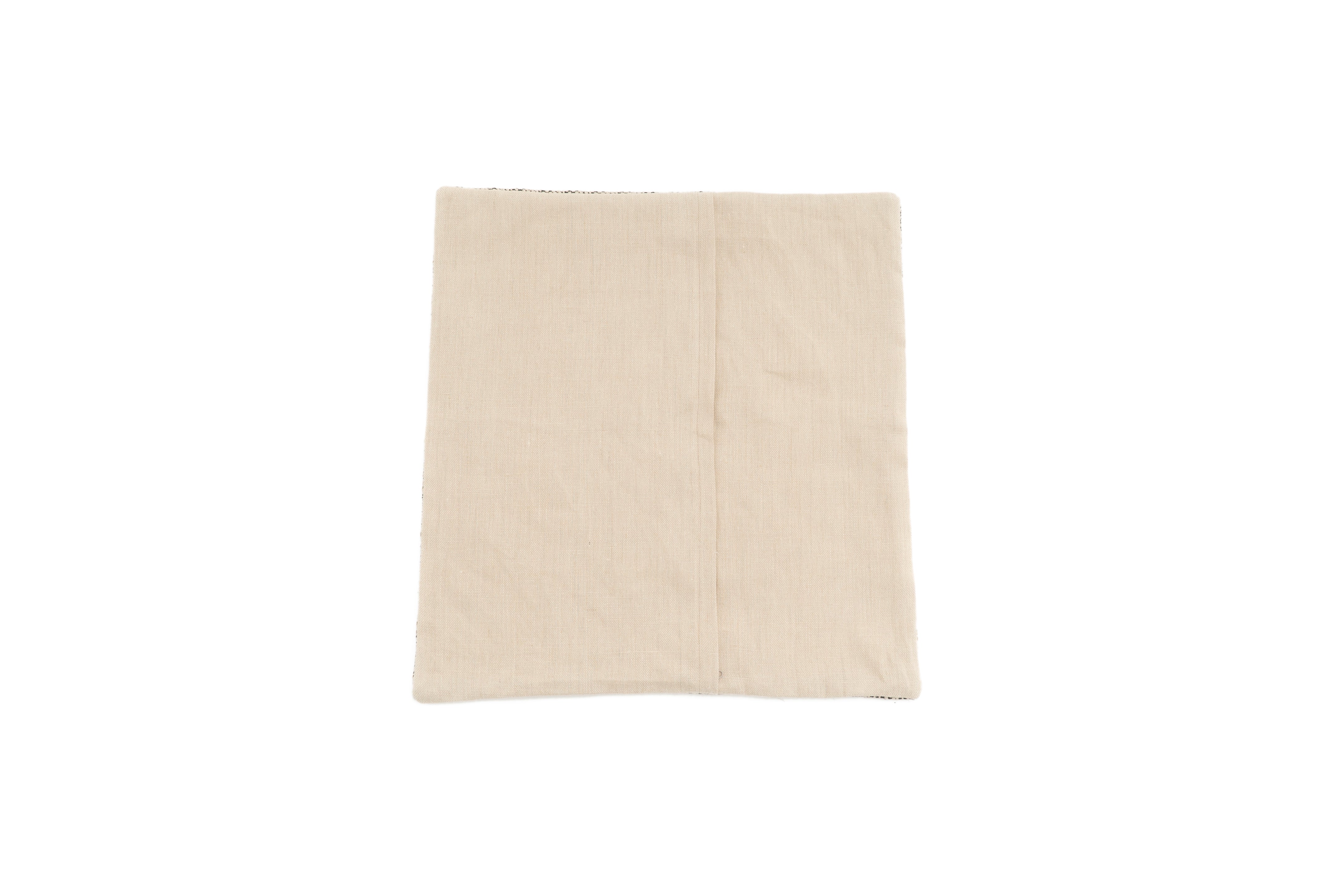 Artisan hemp pillow case, beige and black geometric design, eco-conscious home decor.
