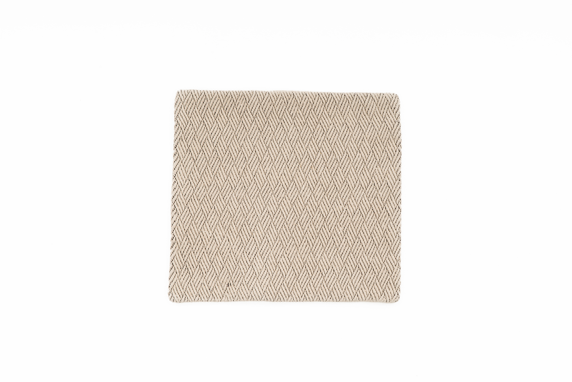 Handwoven beige hemp pillowcase with modern herringbone pattern, eco-friendly.