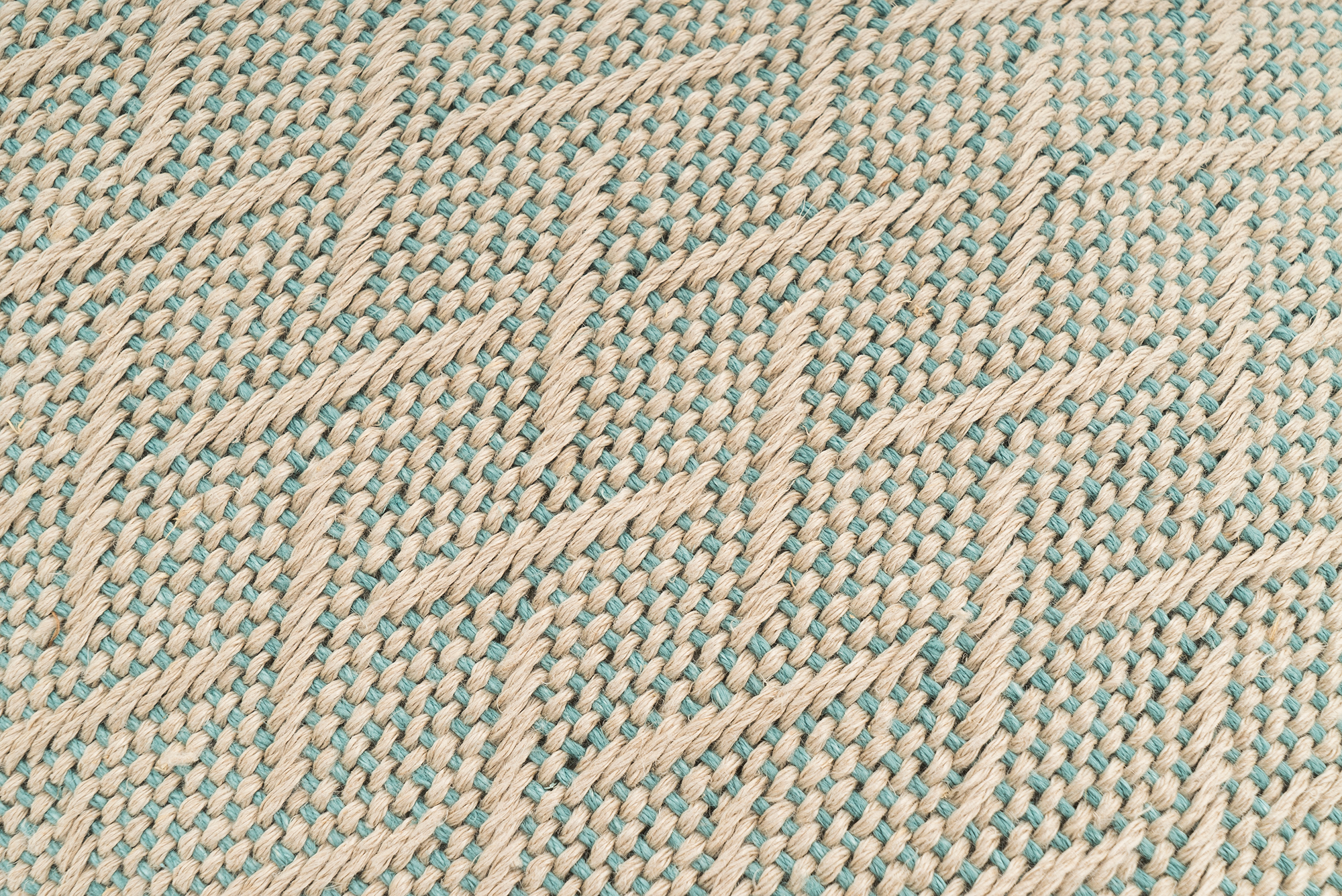 Sustainable hemp pillowcase, handwoven with herringbone pattern, beige tones.