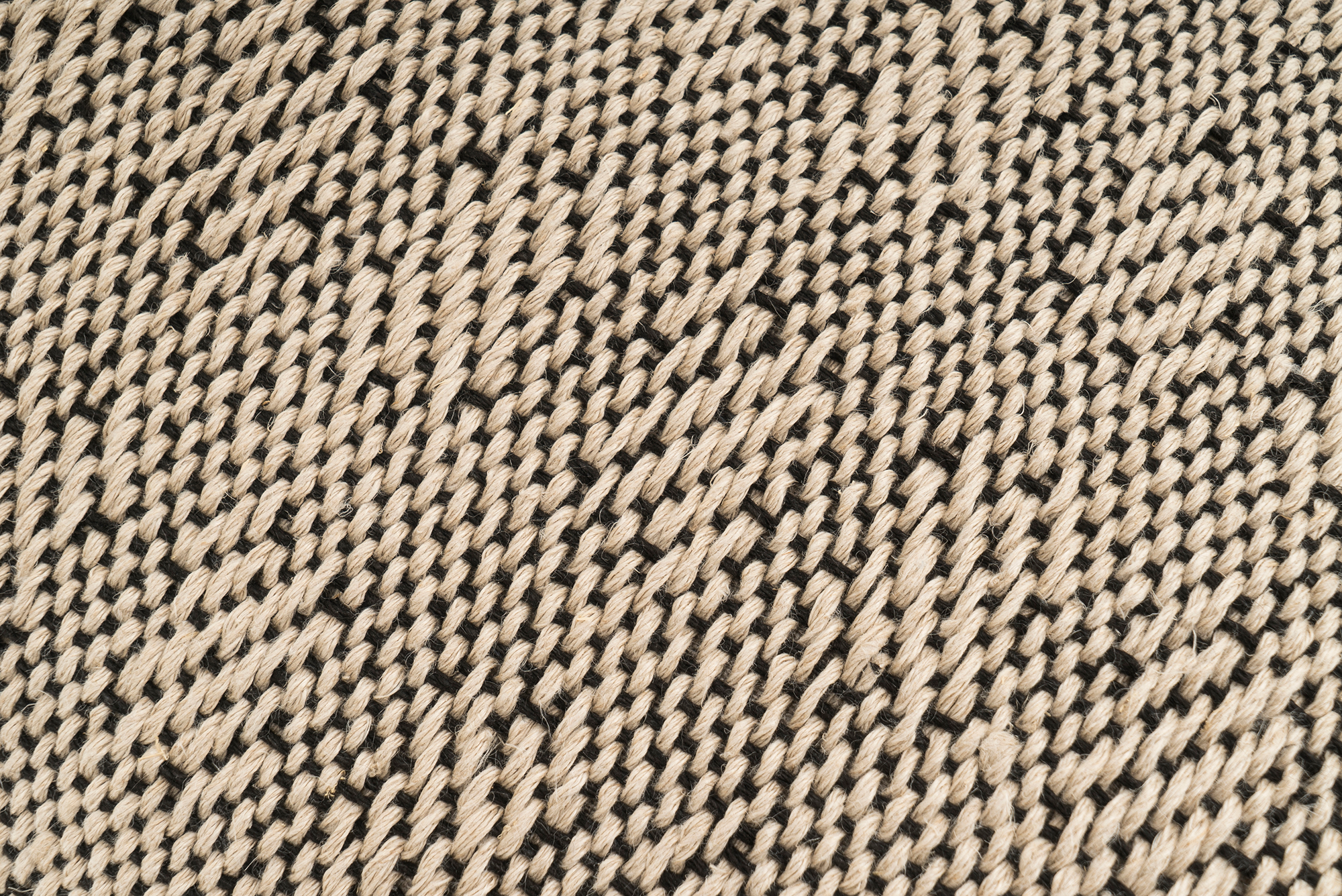 Artisan-crafted hemp pillow case, sustainable beige fabric, rustic herringbone pattern.