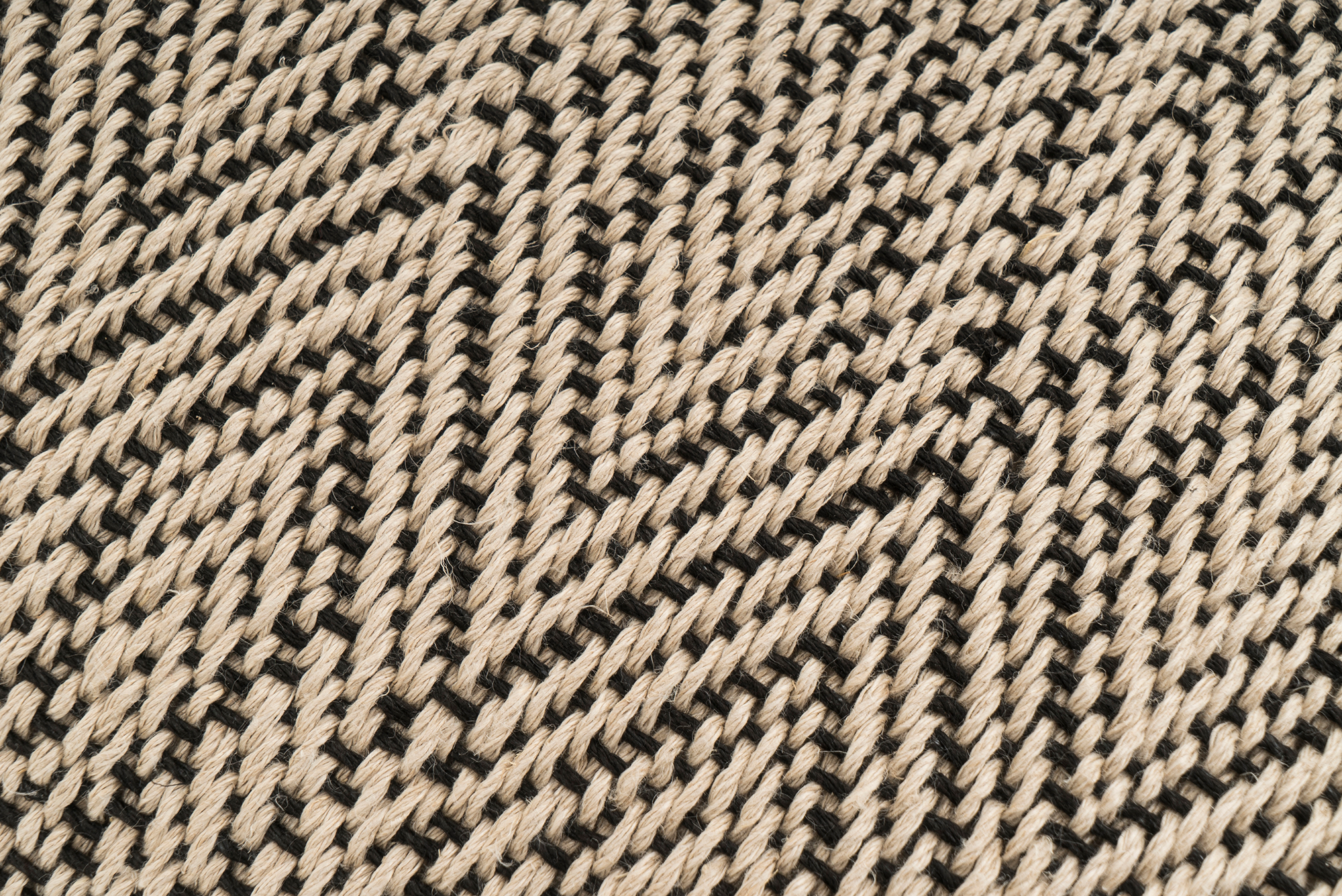 Eco-conscious hemp pillowcase, handwoven with black and beige chevron pattern.