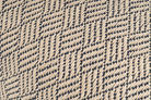 Artisan-crafted hemp pillowcase, featuring a beige and black herringbone pattern, sustainable decor.