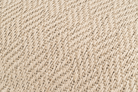 Artisan-made hemp pillowcase, beige herringbone texture, sustainable home decor.