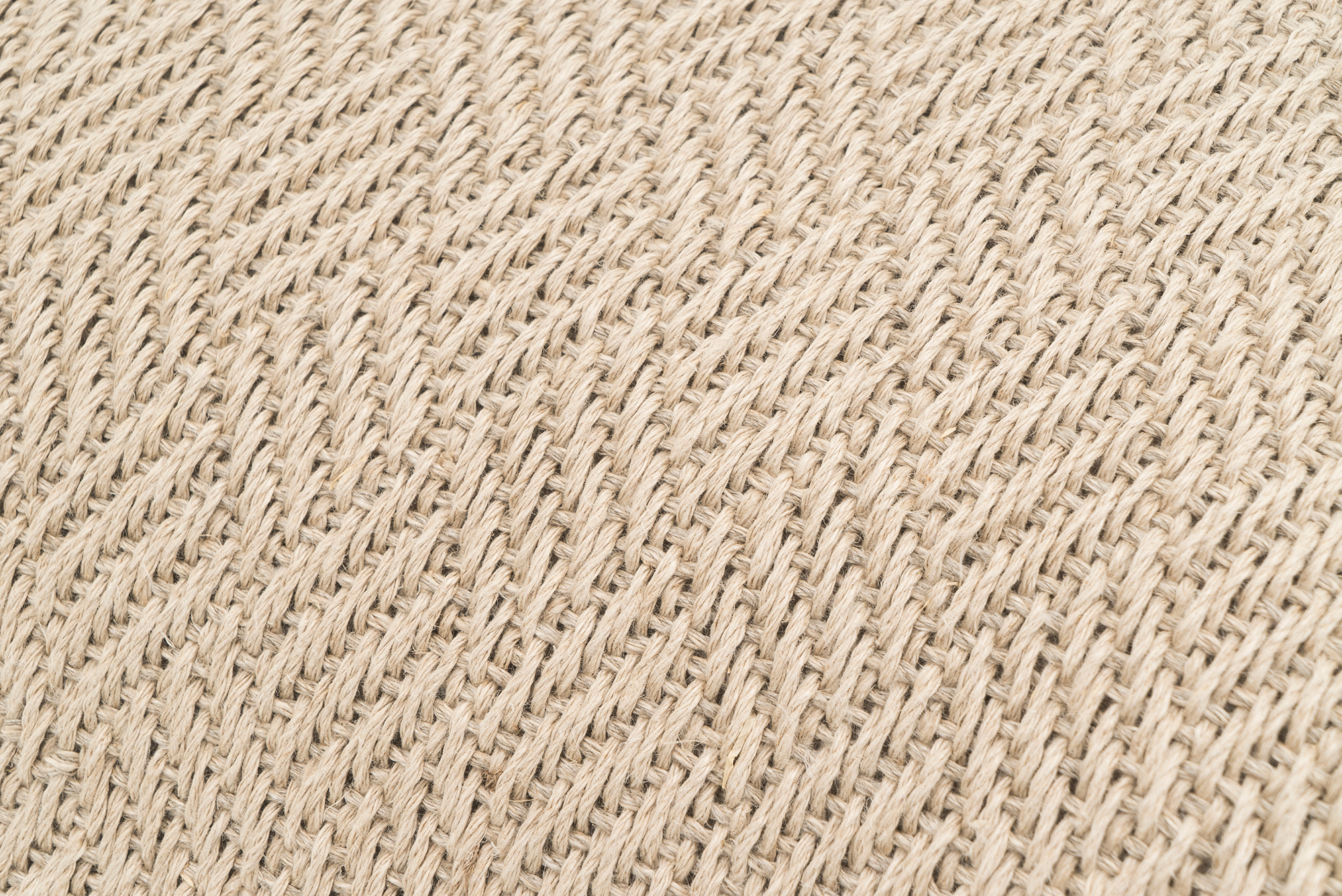 Artisan-made hemp pillowcase, beige herringbone texture, sustainable home decor.