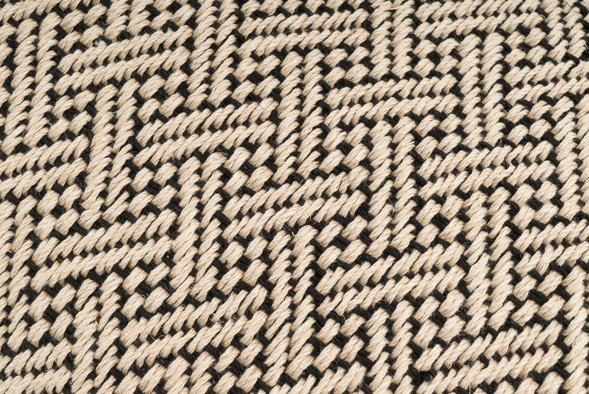 Artisan-crafted hemp pillow case, modern chevron pattern, sustainable material.