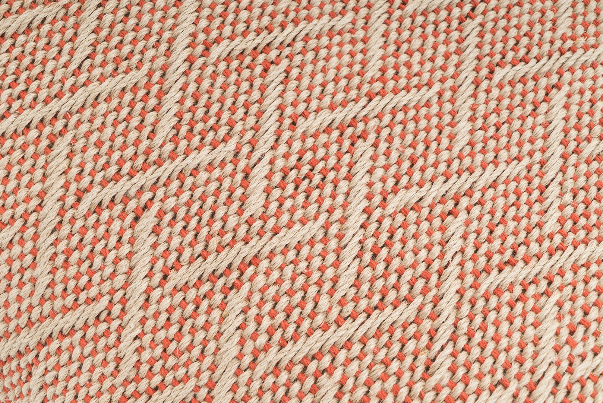 Eco-conscious hemp pillowcase, handwoven with modern peach herringbone pattern.