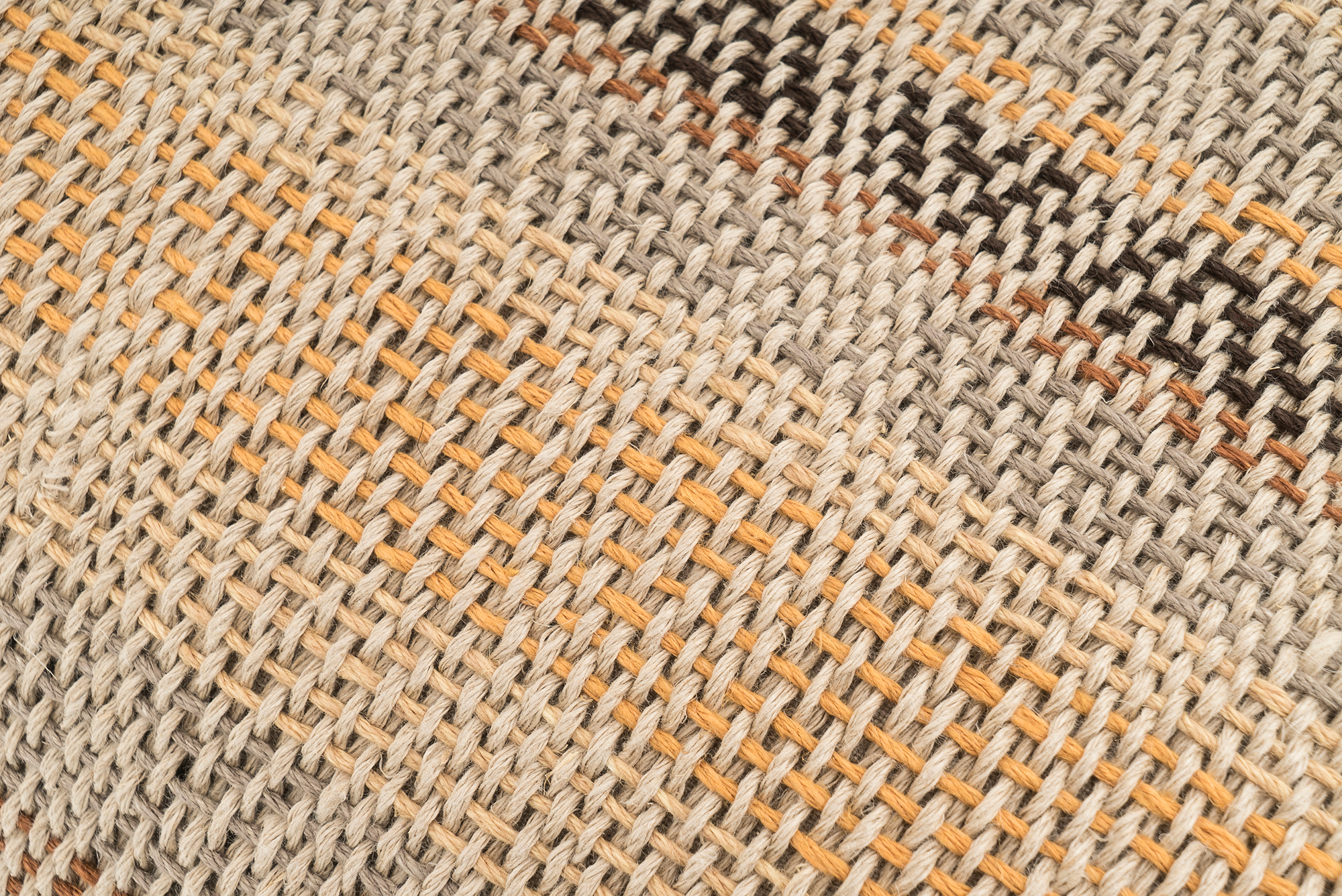 Sustainable hemp pillow cover, handwoven with earthy stripes, beige and black tones.