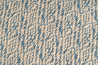 Eco-conscious hemp pillowcase, handwoven with diamond design, beige and blue hues.