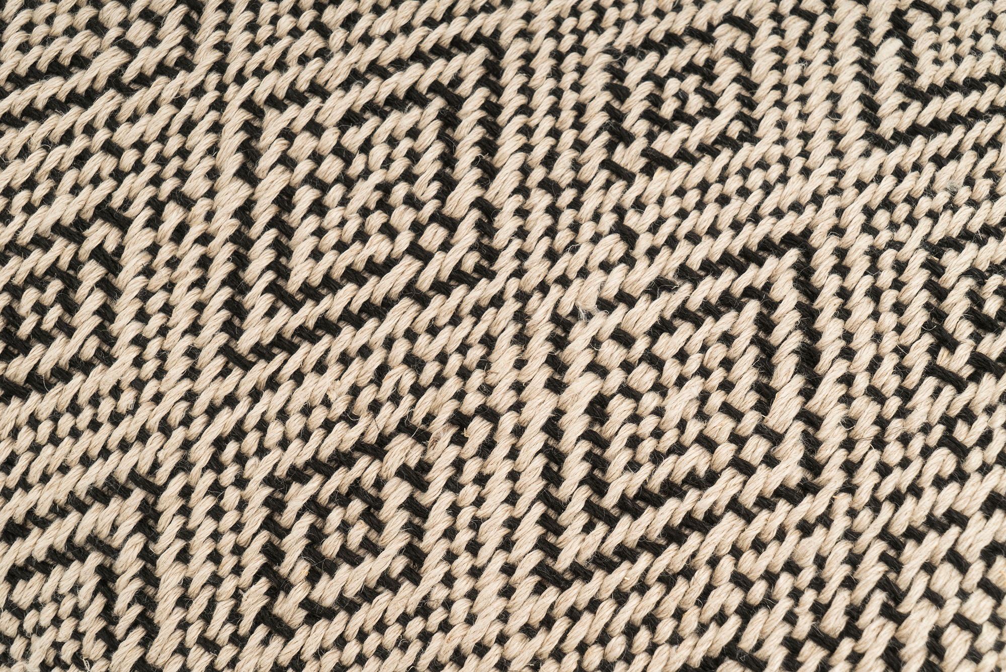 Eco-conscious hemp pillowcase, handwoven with diamond pattern, boho chic style.