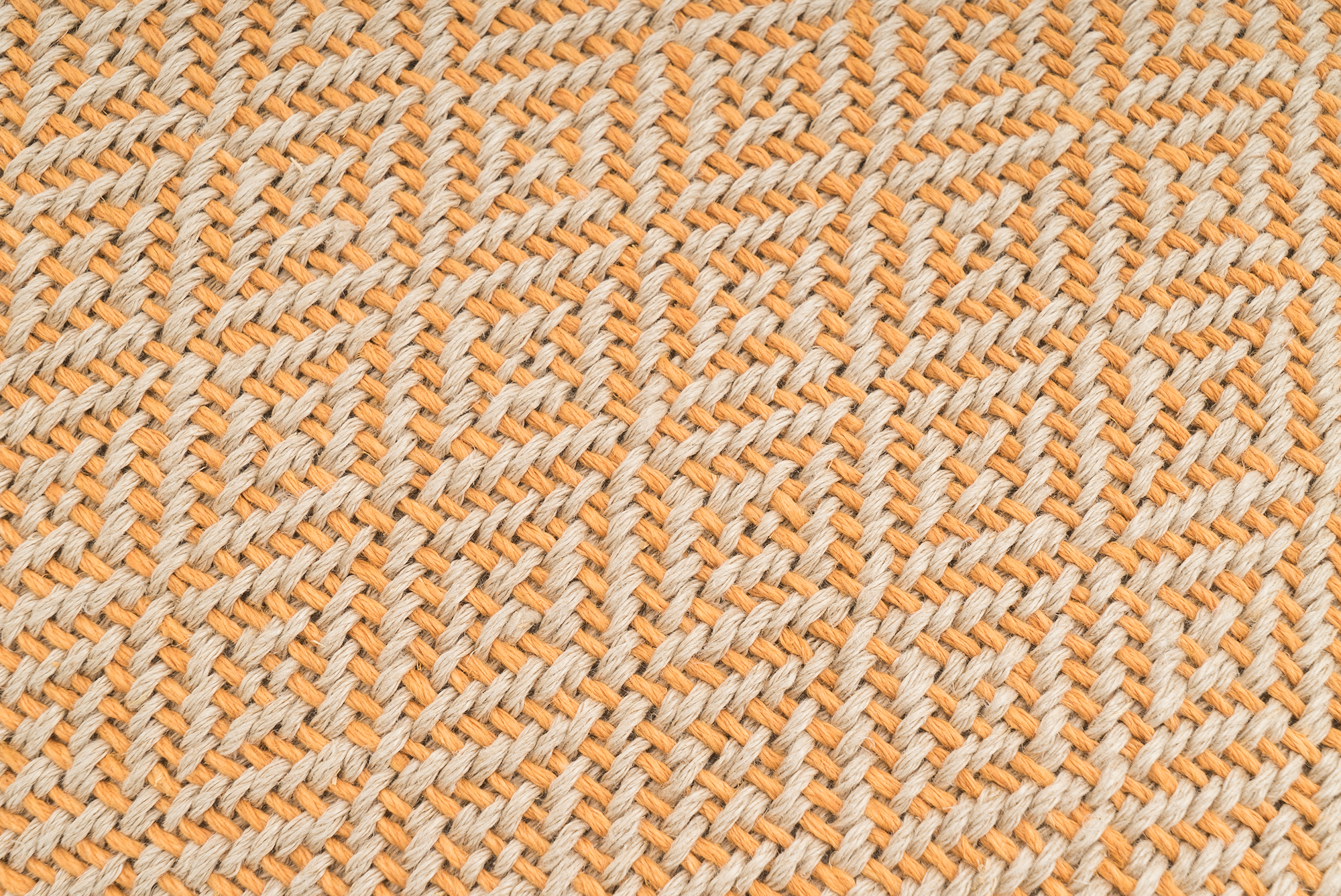 Artisan-crafted hemp pillow cover, geometric pattern, sustainable material.